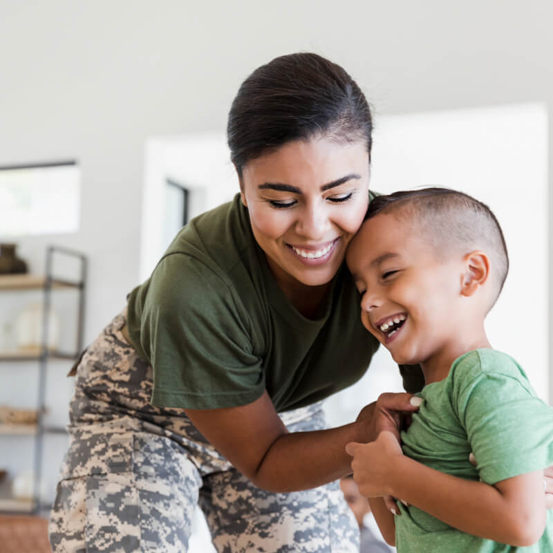 Veteran mom hugging her child